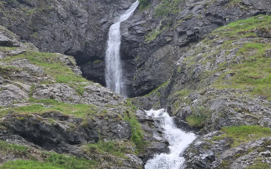 A RIB boat on the Nærøyfjord below steep mountain walls
