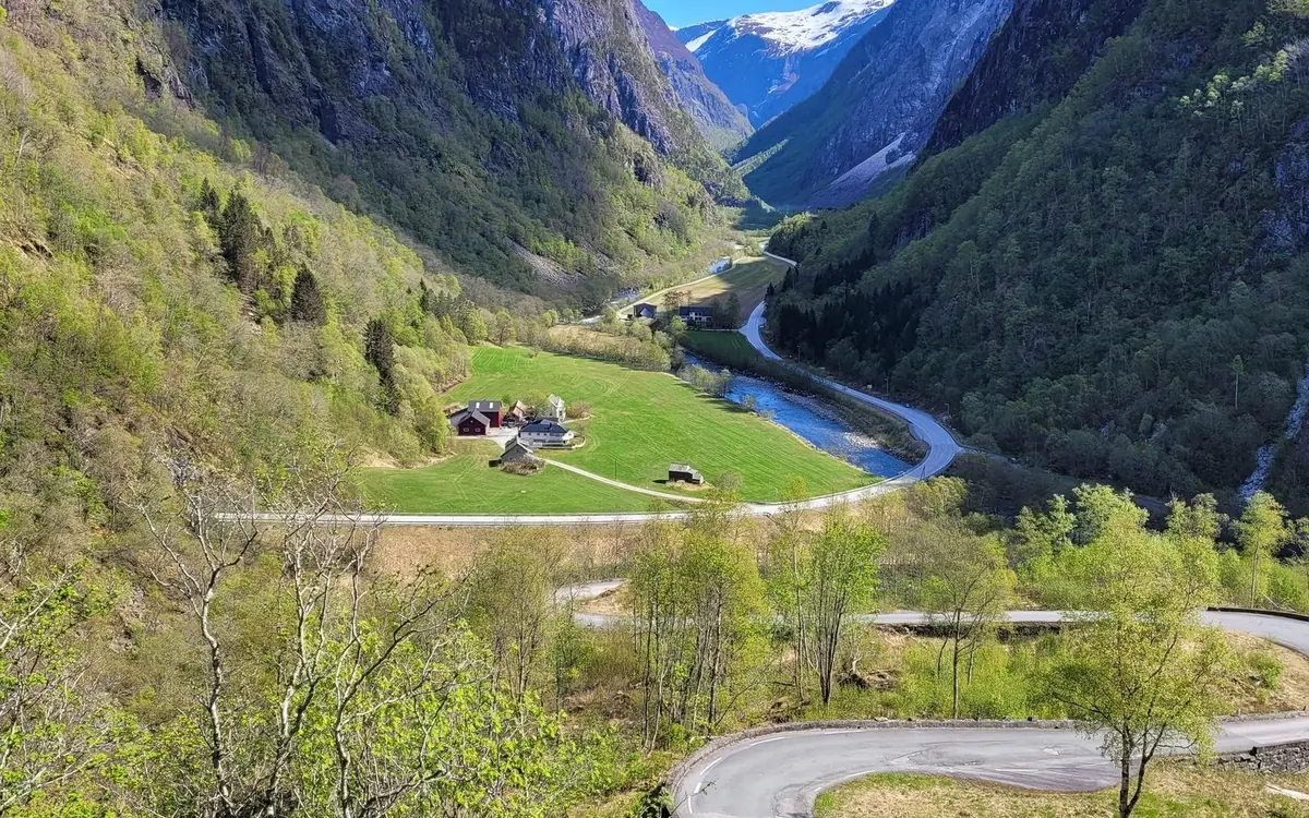 The small fjord village of Undredal on the shore below the mountains