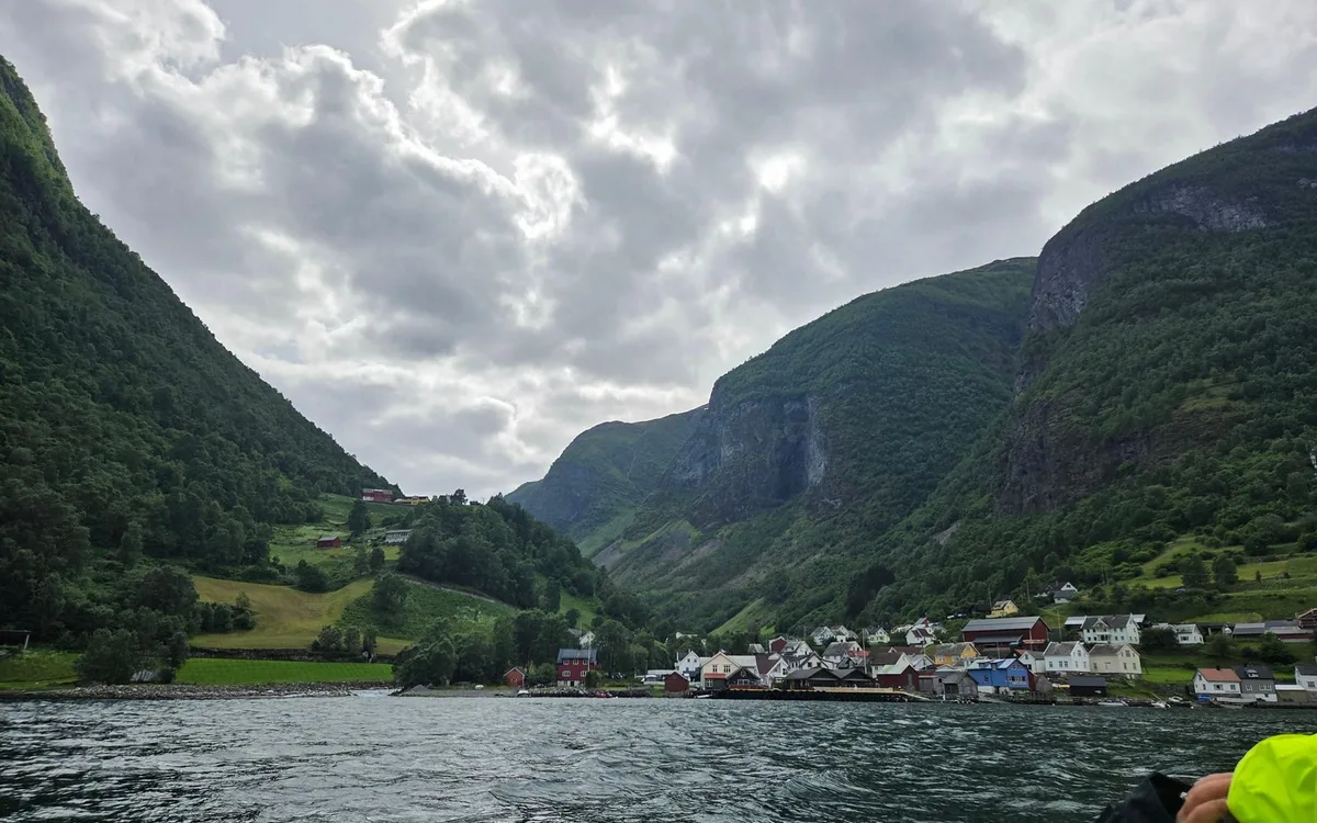 Passengers in warm layers on an open RIB boat in the N&aelig;r&oslash;yfjord